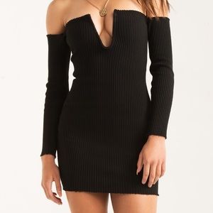 Black plunge neck robbed sweater dress